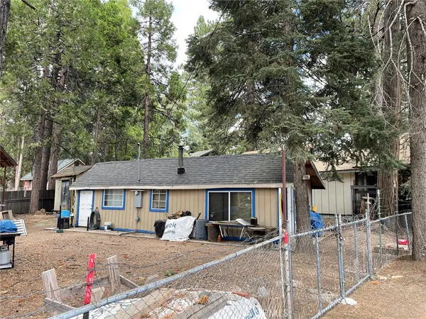 a front view of a house with yard