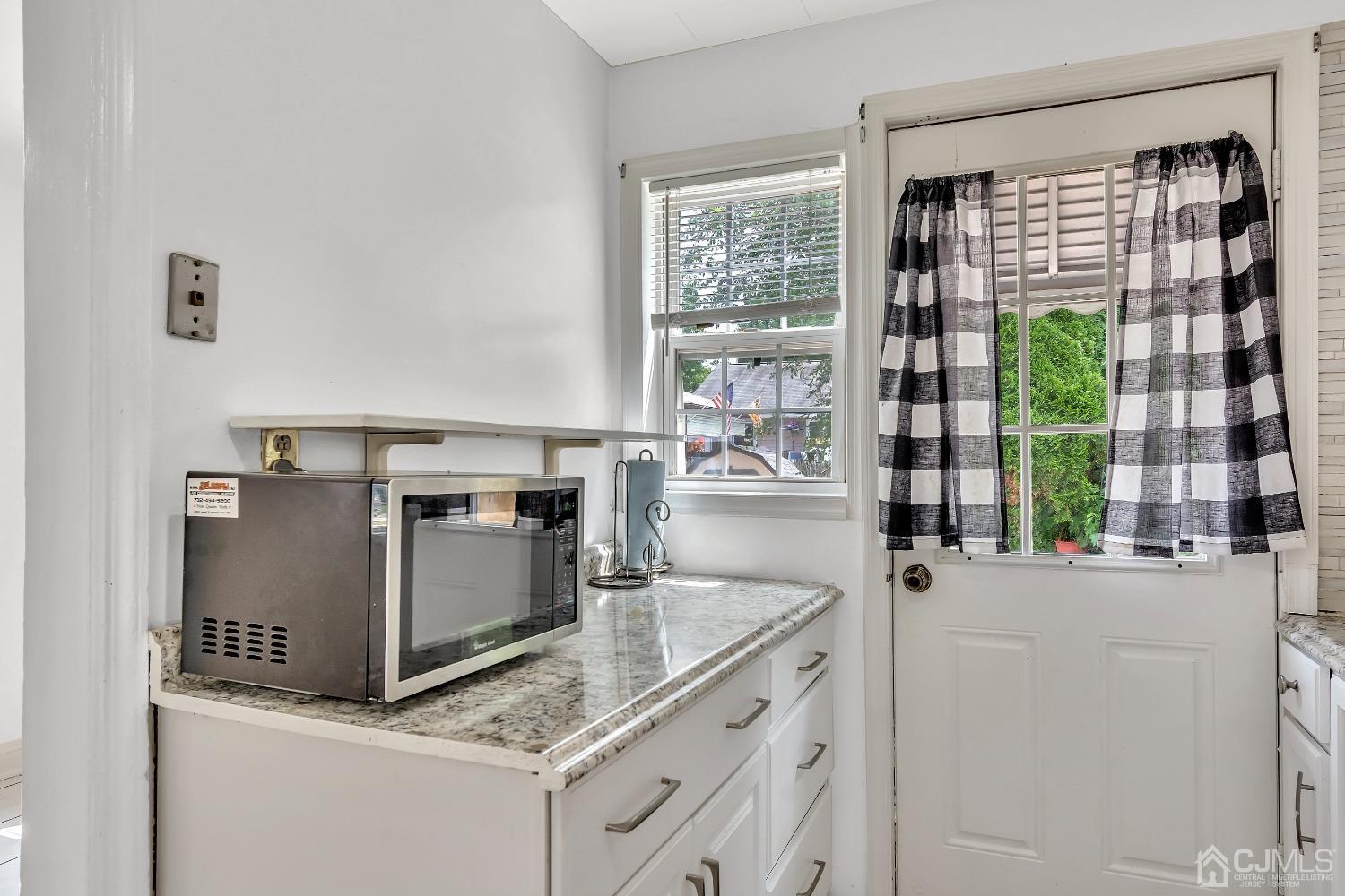42 MacArthur Drive Edison, NJ 08837 - Photo 11 of 25 a kitchen with granite countertop a stove and a sink