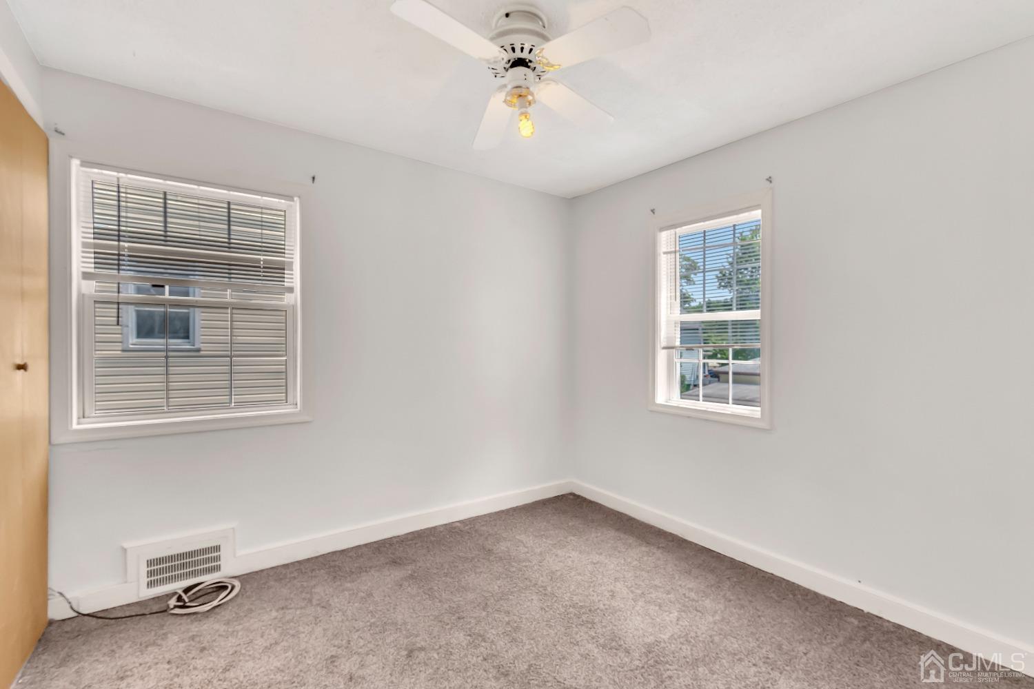 42 MacArthur Drive Edison, NJ 08837 - Photo 15 of 25 a view of a livingroom with a ceiling fan and window