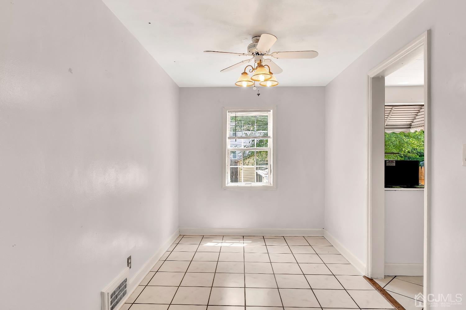 42 MacArthur Drive Edison, NJ 08837 - Photo 8 of 25 a view of an empty room with a window