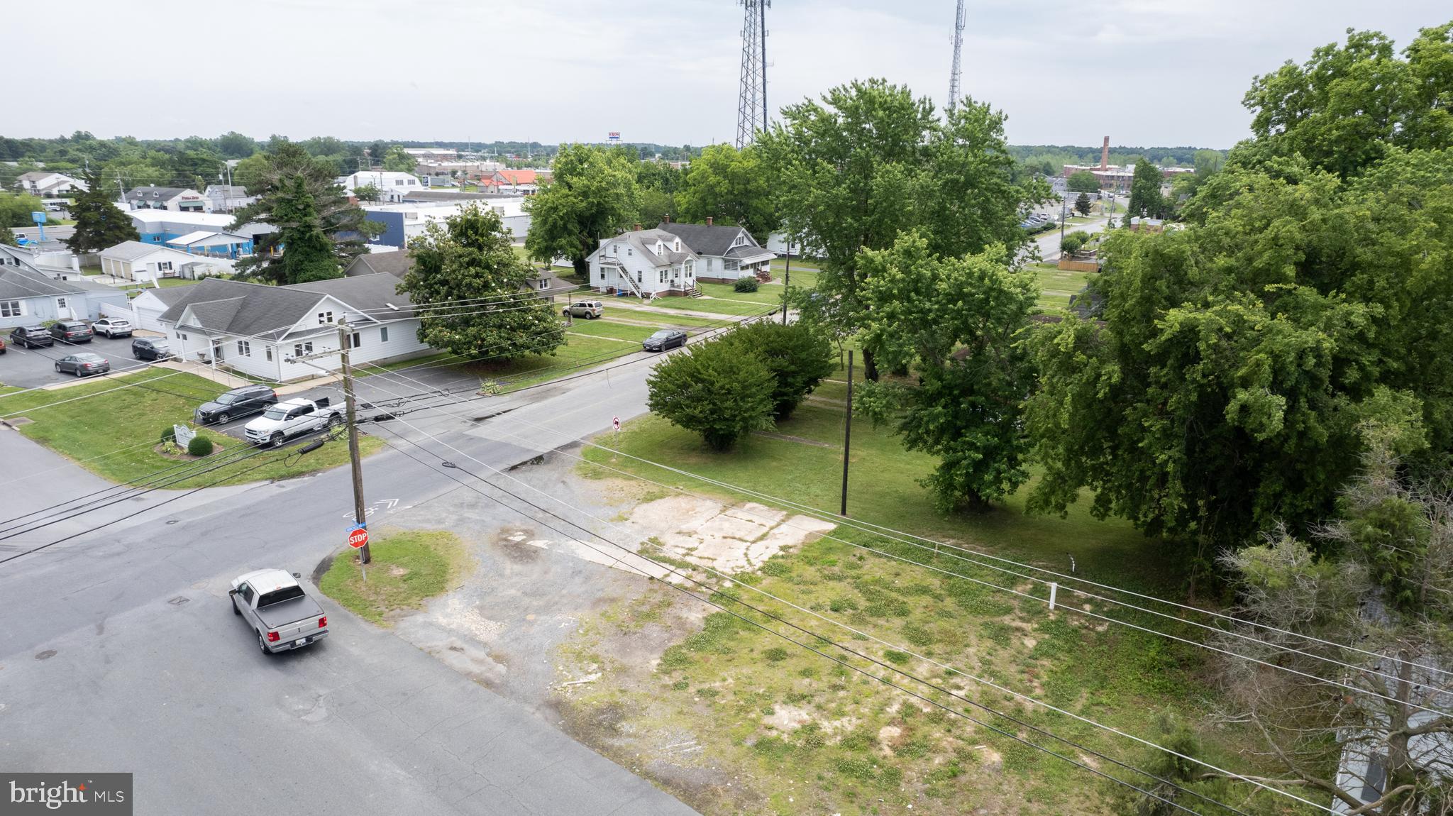 301-303 Dorchester Avenue Cambridge, MD 21613 - Photo 8 of 12 a view of a street with potted plants