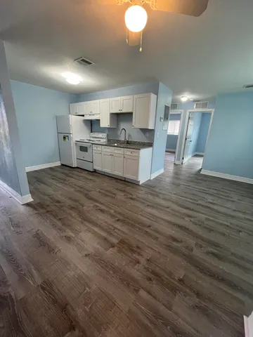 a view of kitchen with wooden floor