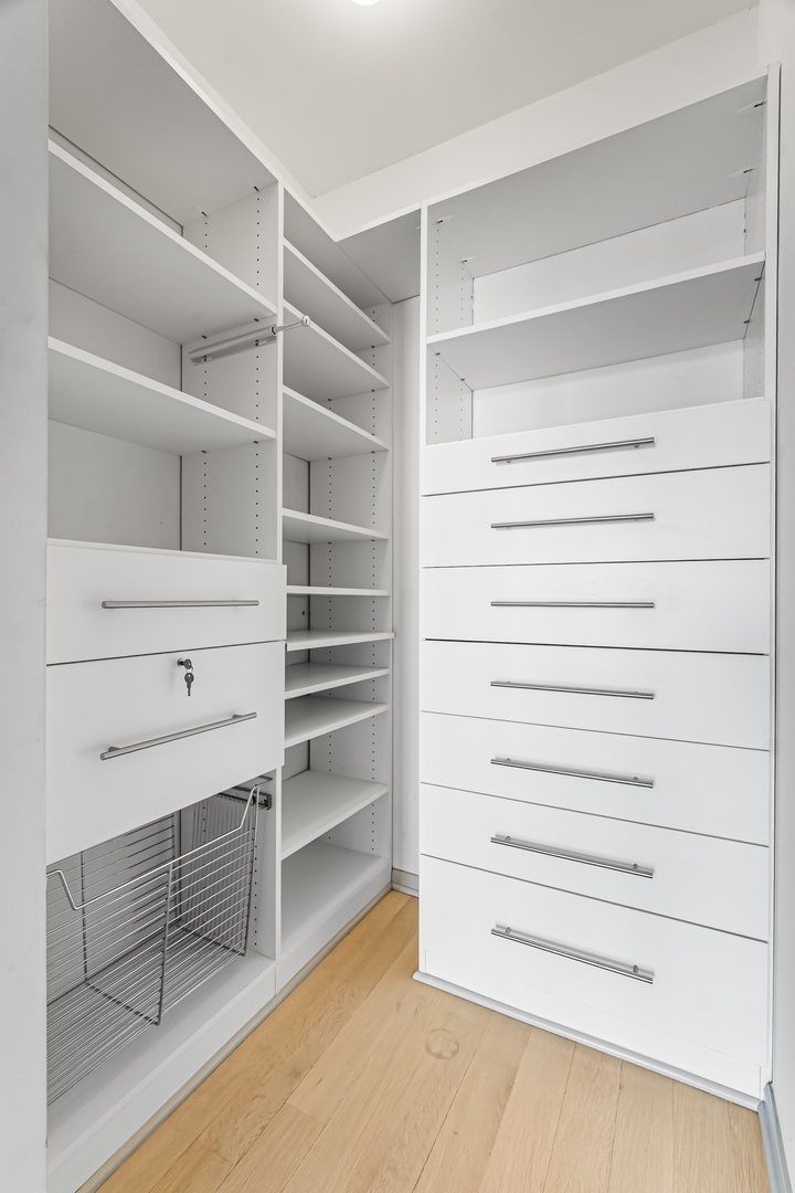 21 West Chestnut Street, Unit 1403 Chicago, IL 60654 - Photo 10 of 19 a view of walk in closet with empty racks