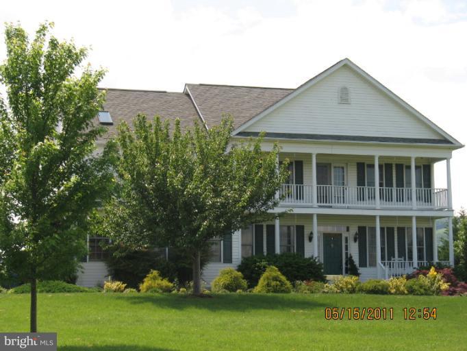 4721 East Basford Road Frederick, MD 21703 - Photo 1 of 28 a front view of a house with garden and plants