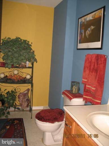 4721 East Basford Road Frederick, MD 21703 - Photo 2 of 28 a bathroom with a toilet and a sink