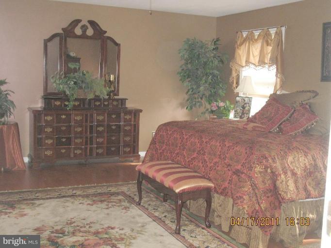 4721 East Basford Road Frederick, MD 21703 - Photo 17 of 28 a bedroom with a bed and a window