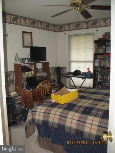 4721 East Basford Road Frederick, MD 21703 - Photo 4 of 28 a bedroom with a bed and wooden floor