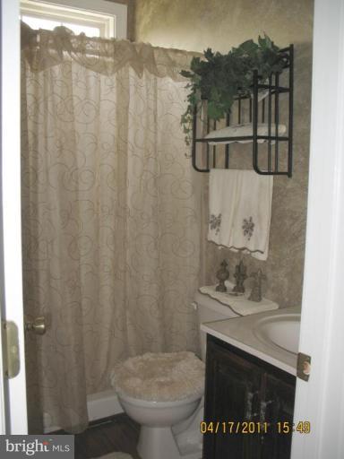 4721 East Basford Road Frederick, MD 21703 - Photo 7 of 28 a bathroom with a sink and a mirror