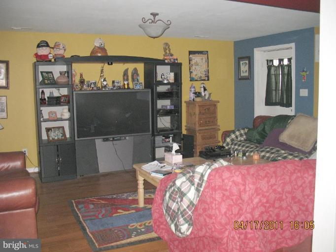 4721 East Basford Road Frederick, MD 21703 - Photo 10 of 28 a living room with furniture and a flat screen tv