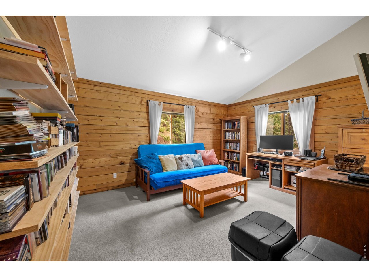 310 Wendelyn Way Boulder, CO 80302 - Photo 19 of 40 a bedroom with furniture and a flat screen tv