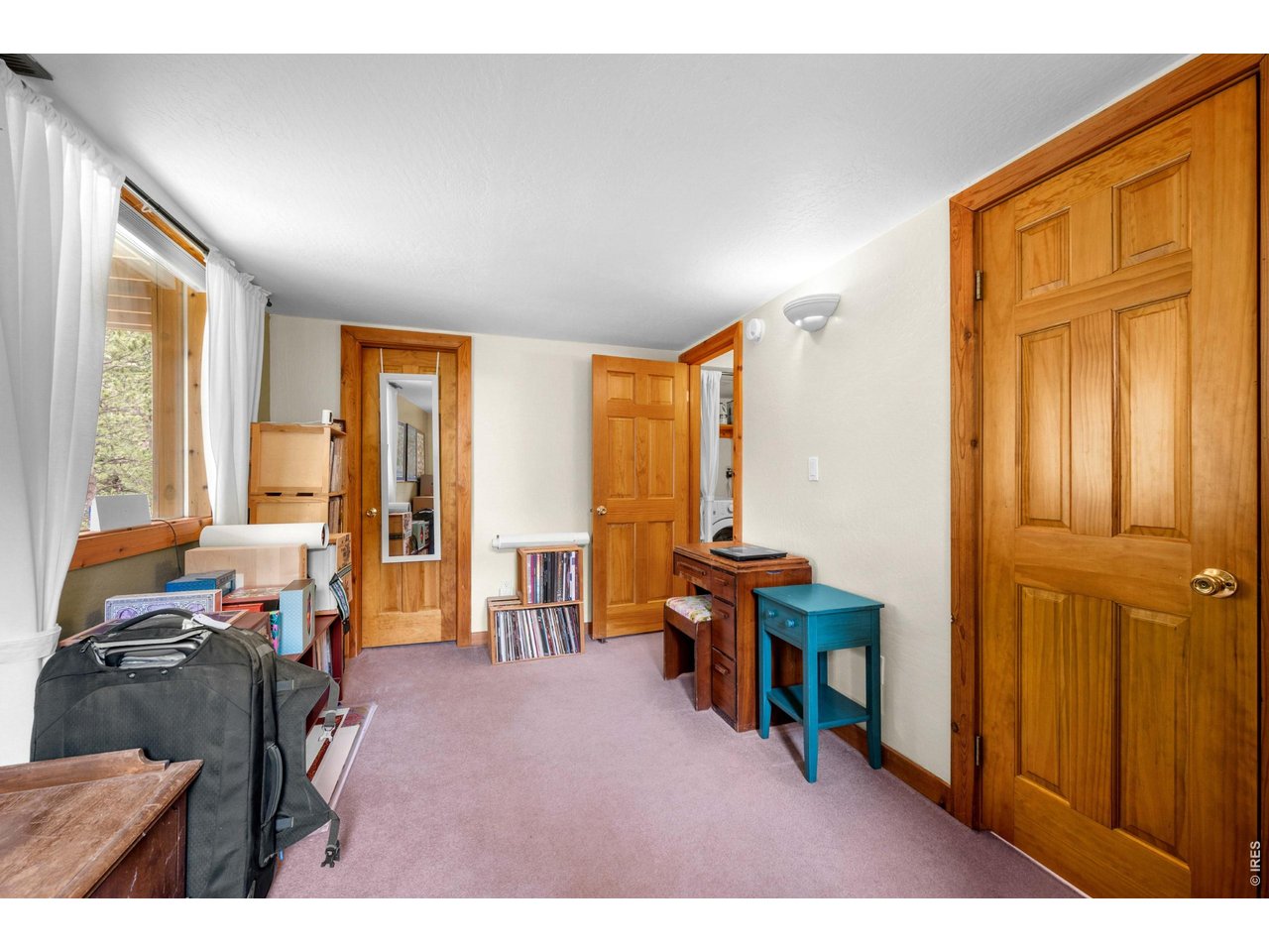 310 Wendelyn Way Boulder, CO 80302 - Photo 27 of 40 a living room with furniture and a window