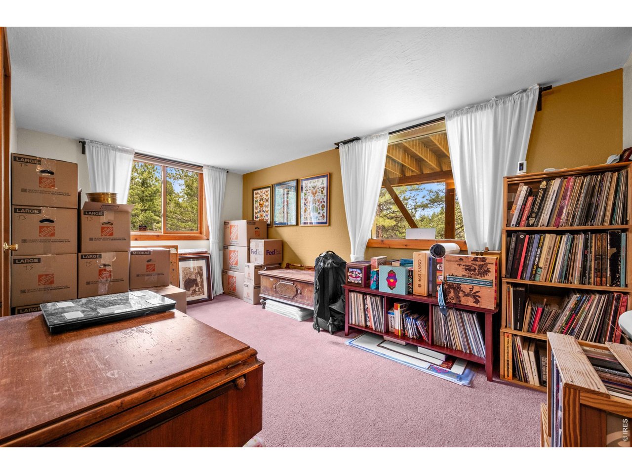 310 Wendelyn Way Boulder, CO 80302 - Photo 28 of 40 a living room with furniture a bookshelf and a window