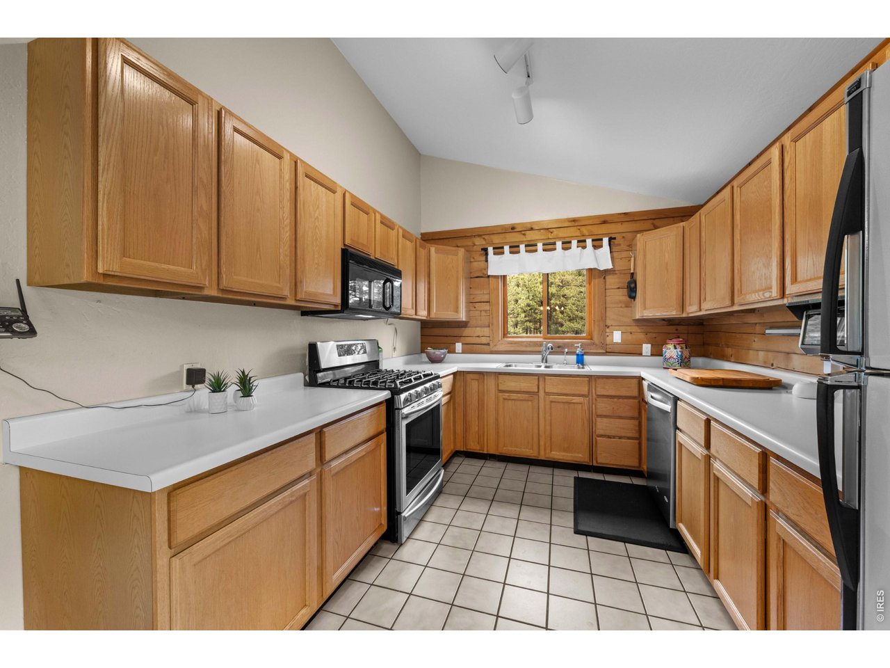 310 Wendelyn Way Boulder, CO 80302 - Photo 10 of 40 a kitchen with a sink a stove top oven and cabinets