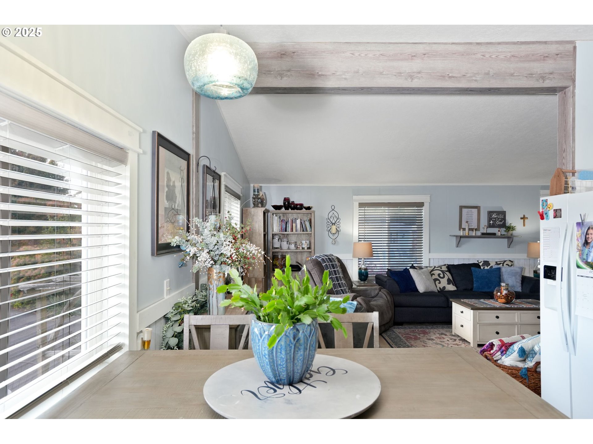 340 Northeast Crest Street, Unit 71 Sublimity, OR 97385 - Photo 17 of 33 a dining table with chairs and a potted plant