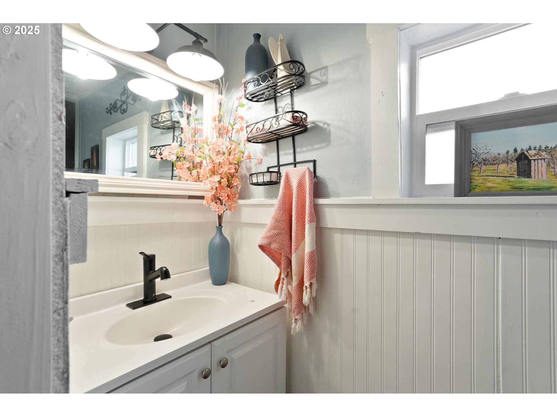 340 Northeast Crest Street, Unit 71 Sublimity, OR 97385 - Photo 25 of 33 a bathroom with a sink and a mirror