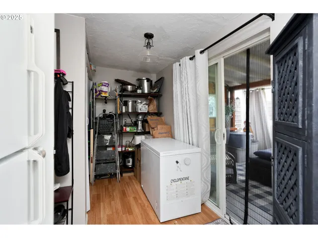 a view of kitchen with furniture and wooden floor