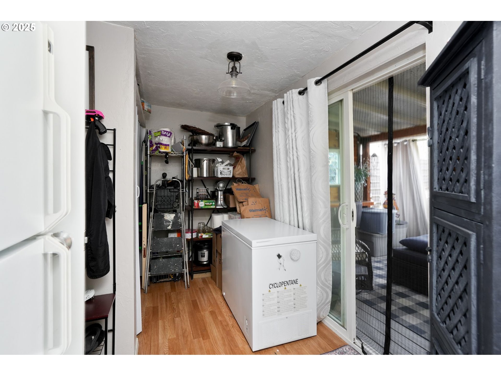 340 Northeast Crest Street, Unit 71 Sublimity, OR 97385 - Photo 26 of 33 a view of kitchen with furniture and wooden floor
