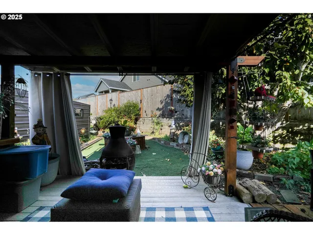 a view of a porch with furniture and a potted plant
