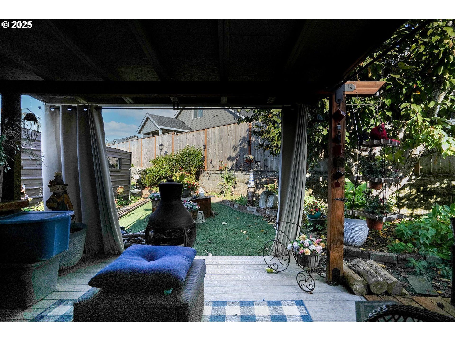340 Northeast Crest Street, Unit 71 Sublimity, OR 97385 - Photo 27 of 33 a view of a porch with furniture and a potted plant