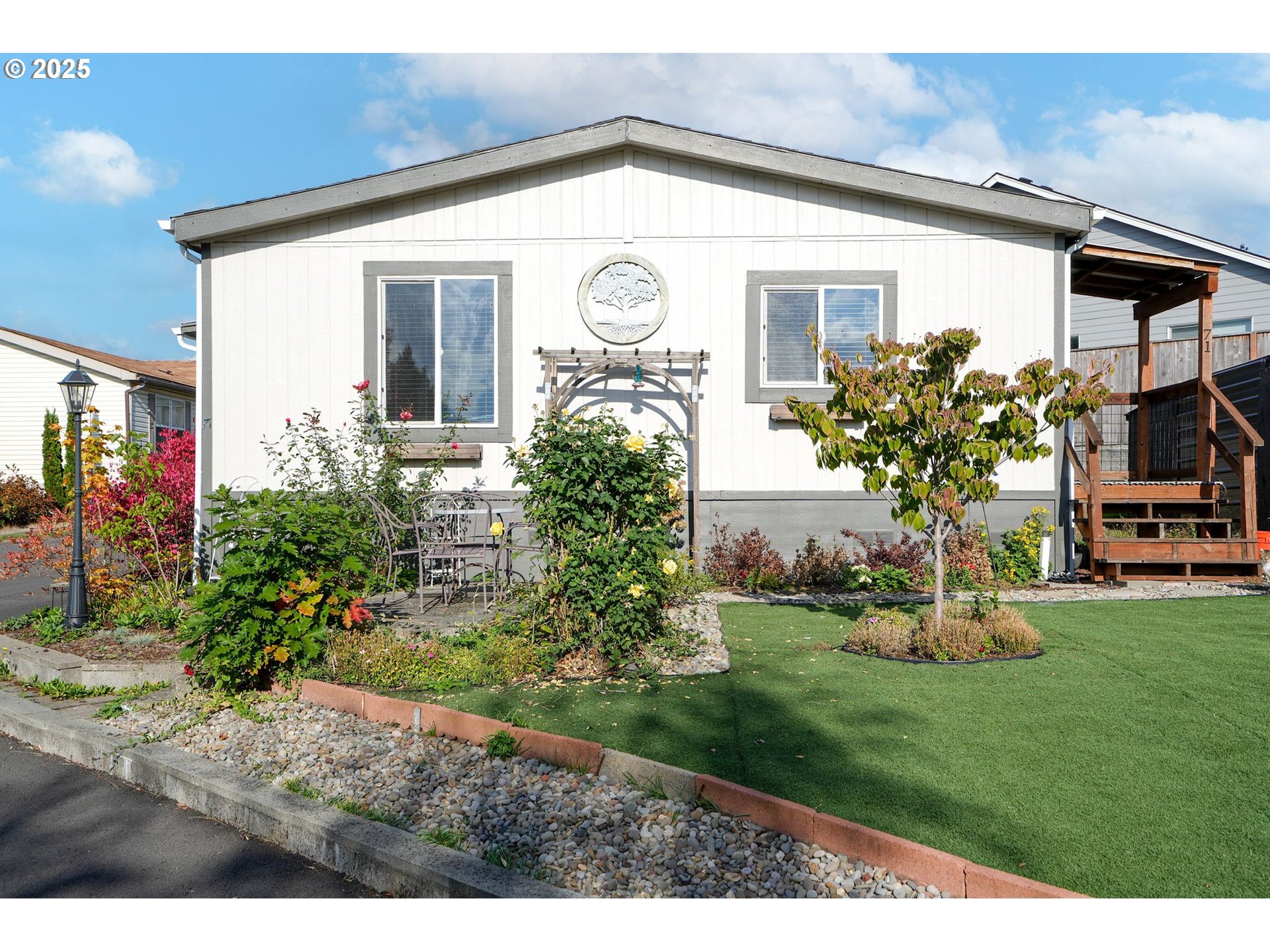 340 Northeast Crest Street, Unit 71 Sublimity, OR 97385 - Photo 8 of 33 a front view of a house with garden
