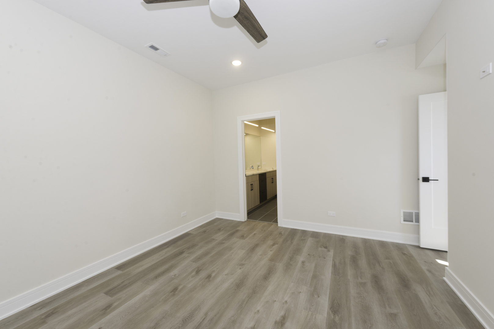 3762 South Indiana Avenue Chicago, IL 60653 - Photo 11 of 27 a view of an empty room with wooden floor