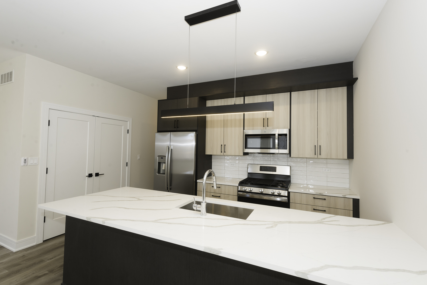 3762 South Indiana Avenue Chicago, IL 60653 - Photo 21 of 27 a kitchen with a refrigerator and a stove top oven