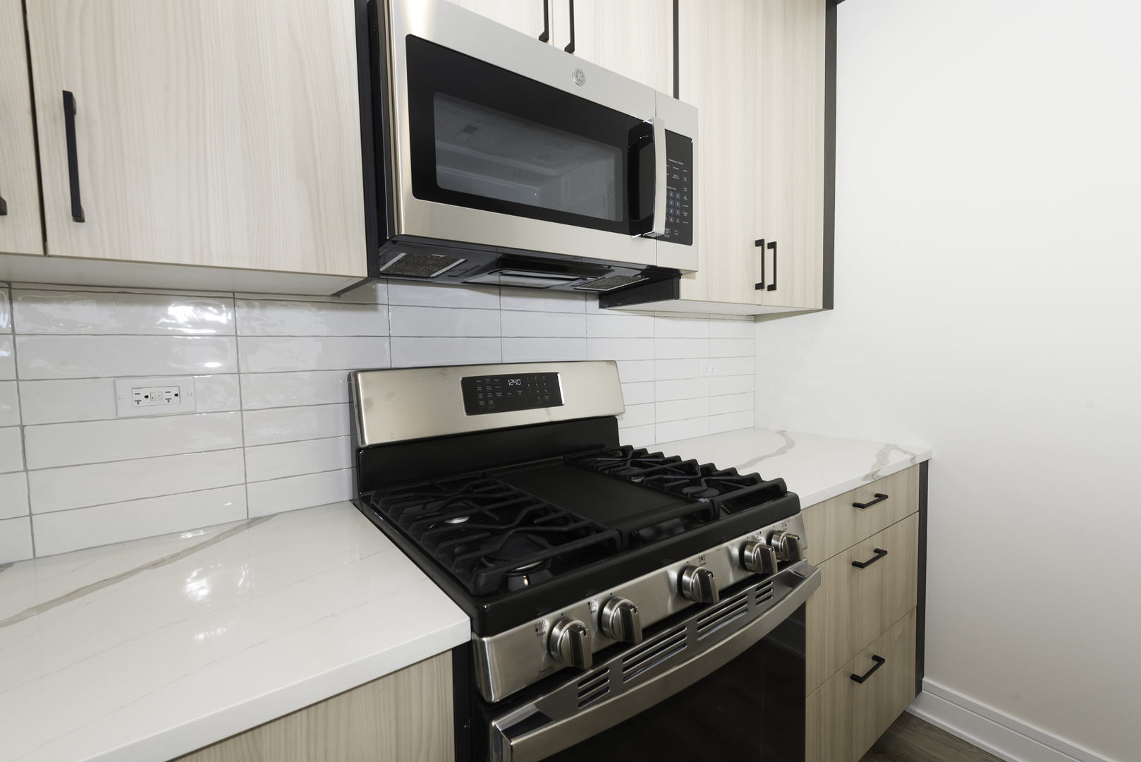3762 South Indiana Avenue Chicago, IL 60653 - Photo 23 of 27 a stove top oven sitting inside of a kitchen
