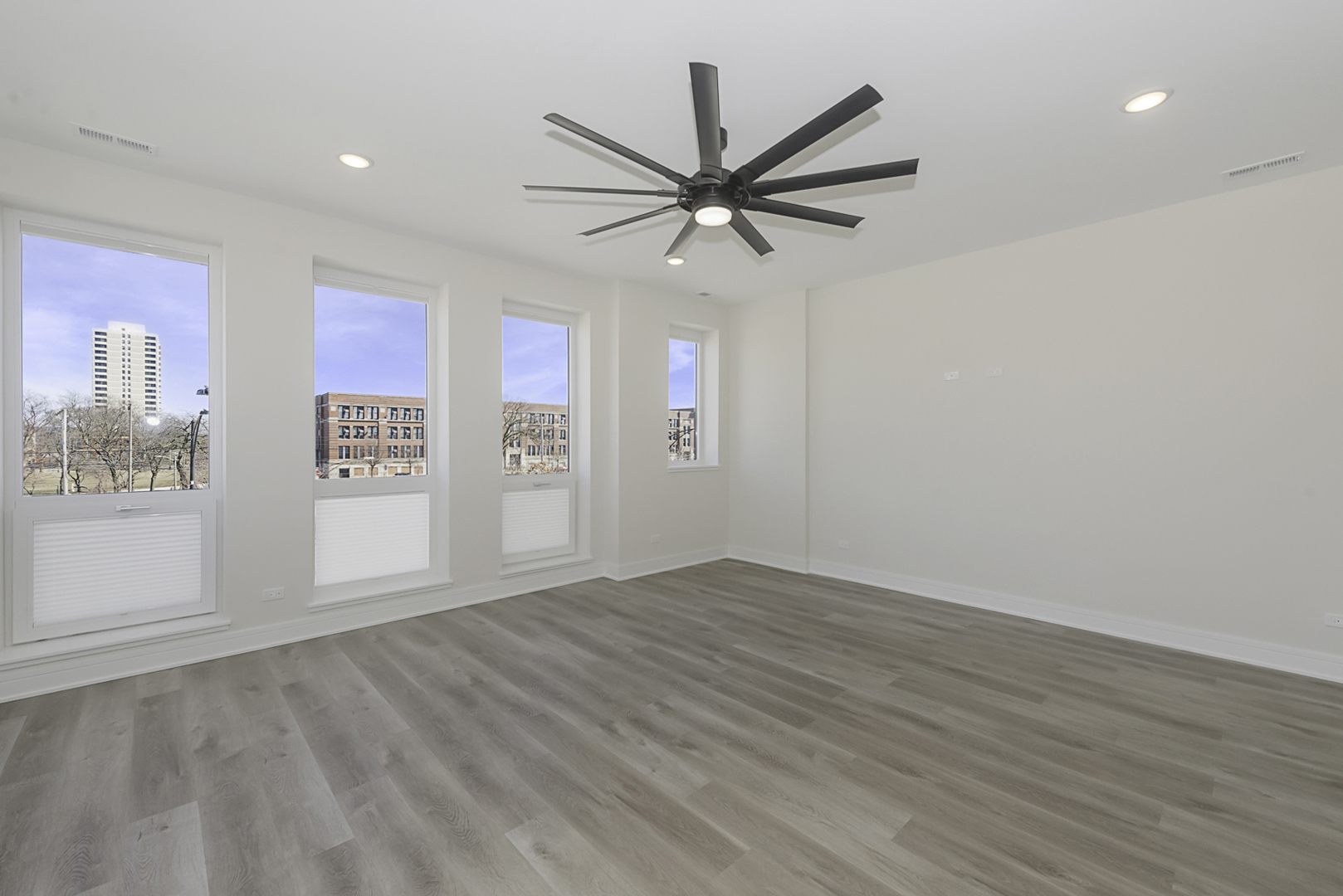 3762 South Indiana Avenue Chicago, IL 60653 - Photo 4 of 27 wooden floor in an empty room with a window