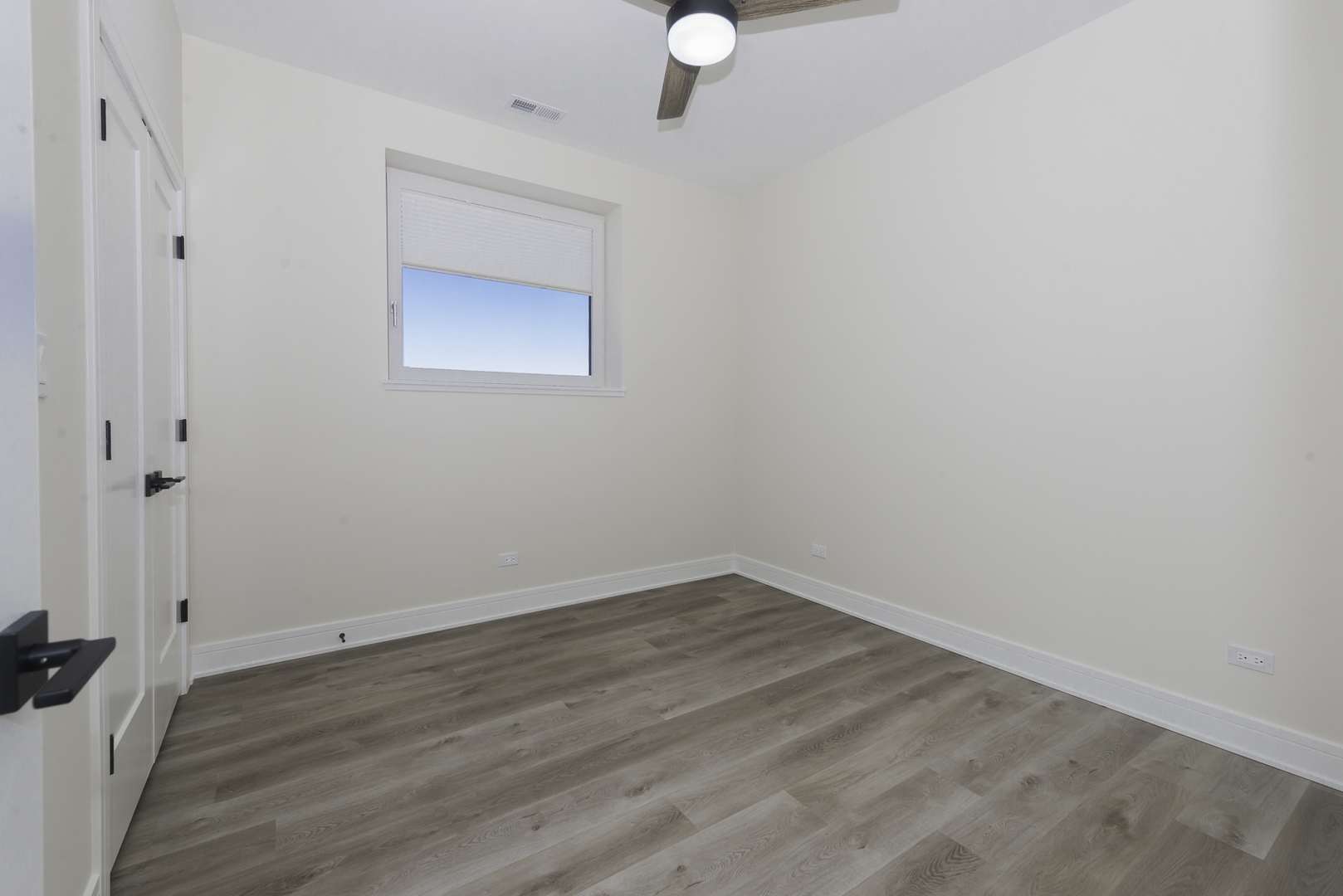 3762 South Indiana Avenue Chicago, IL 60653 - Photo 5 of 27 a view of an empty room with wooden floor