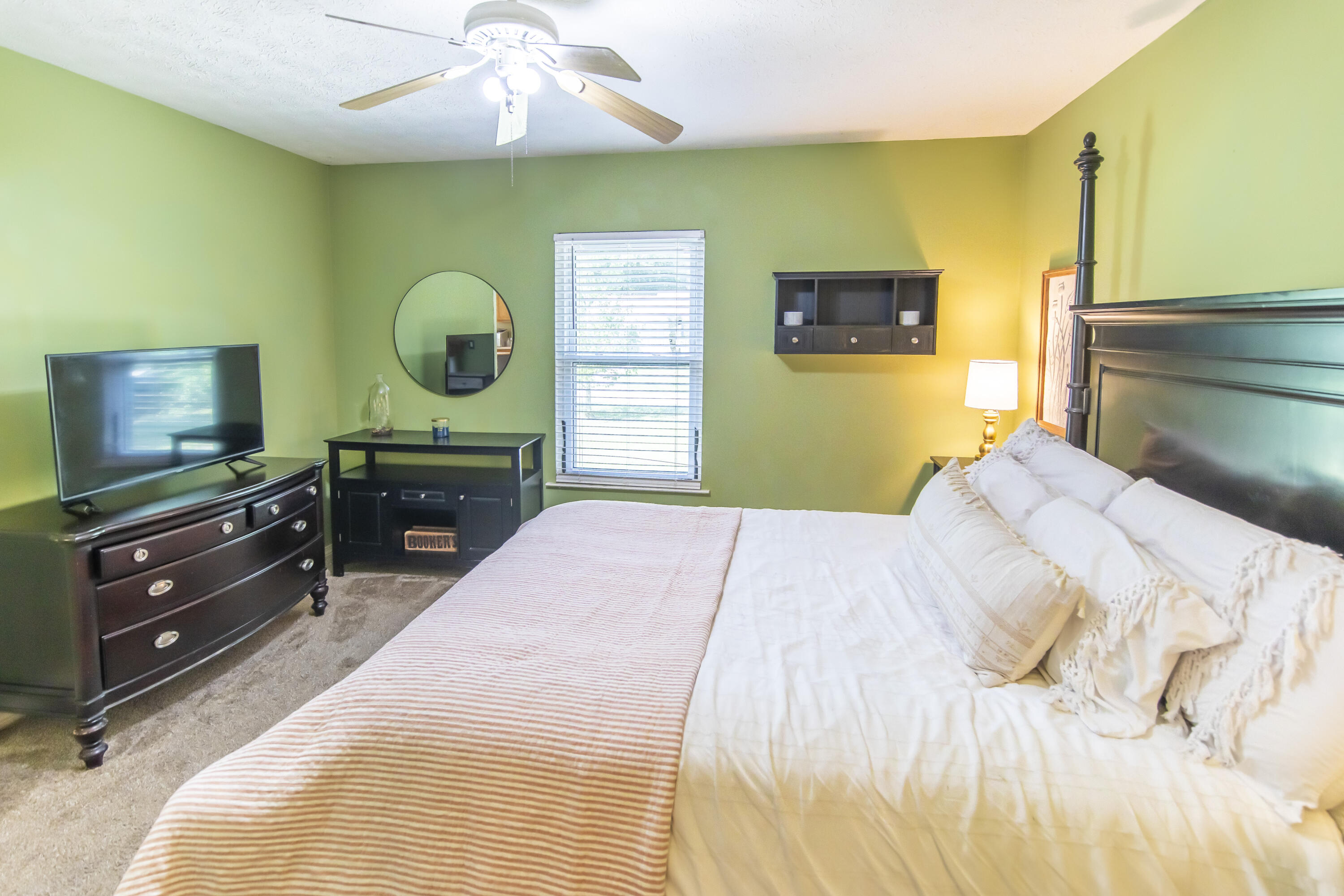 601 Chat Holley Road Santa Rosa Beach, FL 32459 - Photo 12 of 32 a bedroom with a bed and a flat screen tv