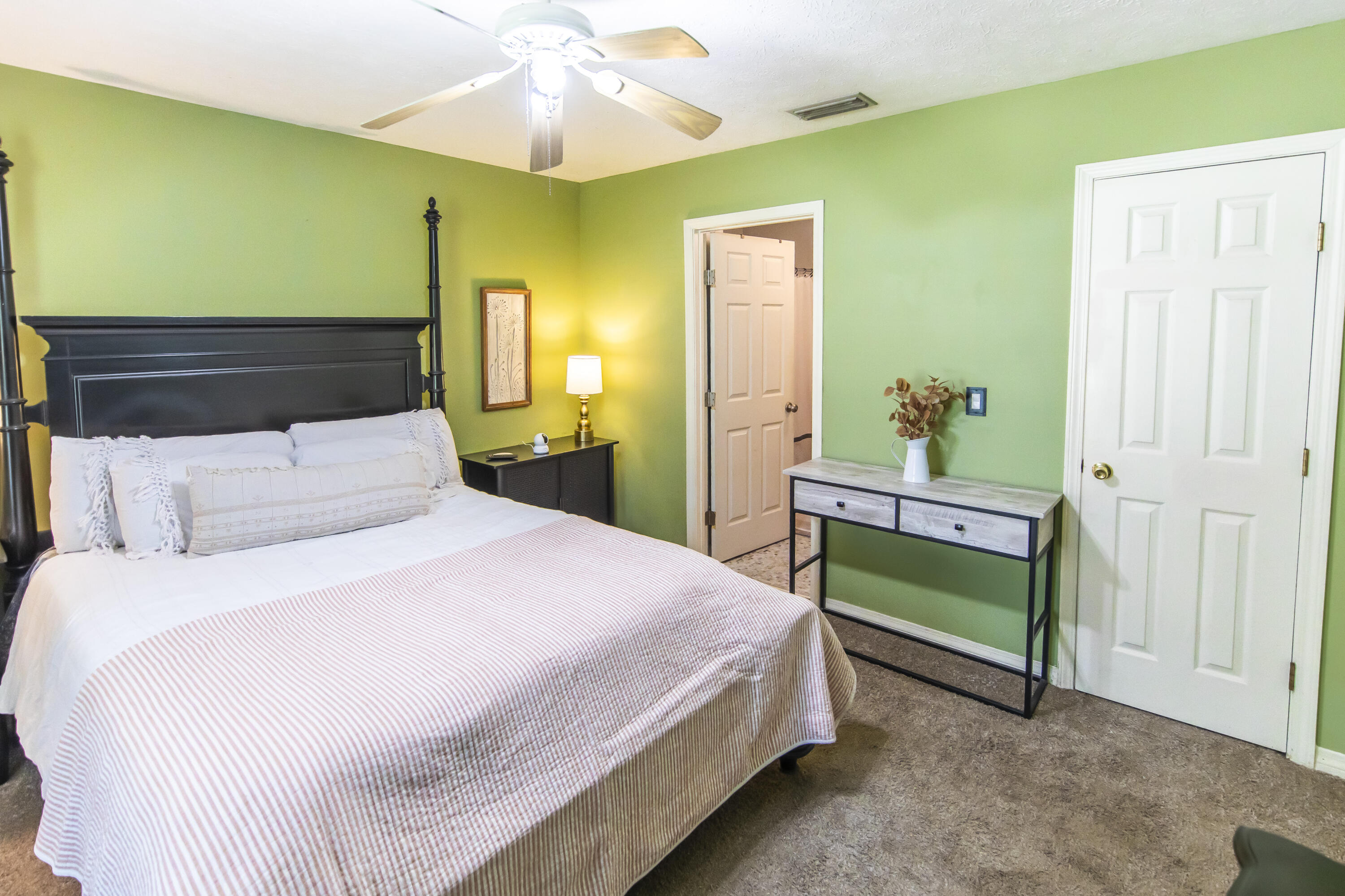 601 Chat Holley Road Santa Rosa Beach, FL 32459 - Photo 13 of 32 a bedroom with a bed and a chandelier