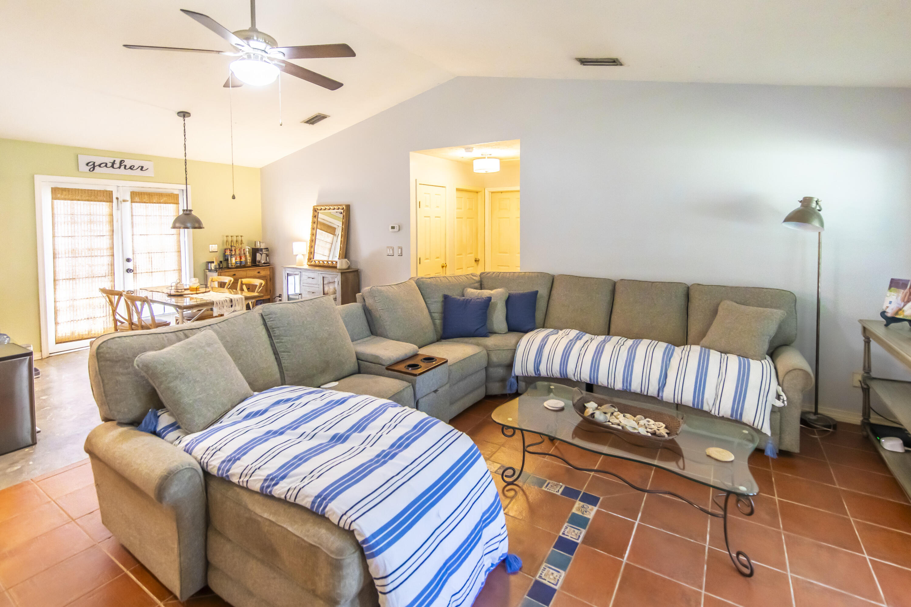 601 Chat Holley Road Santa Rosa Beach, FL 32459 - Photo 2 of 32 a living room with furniture and a chandelier