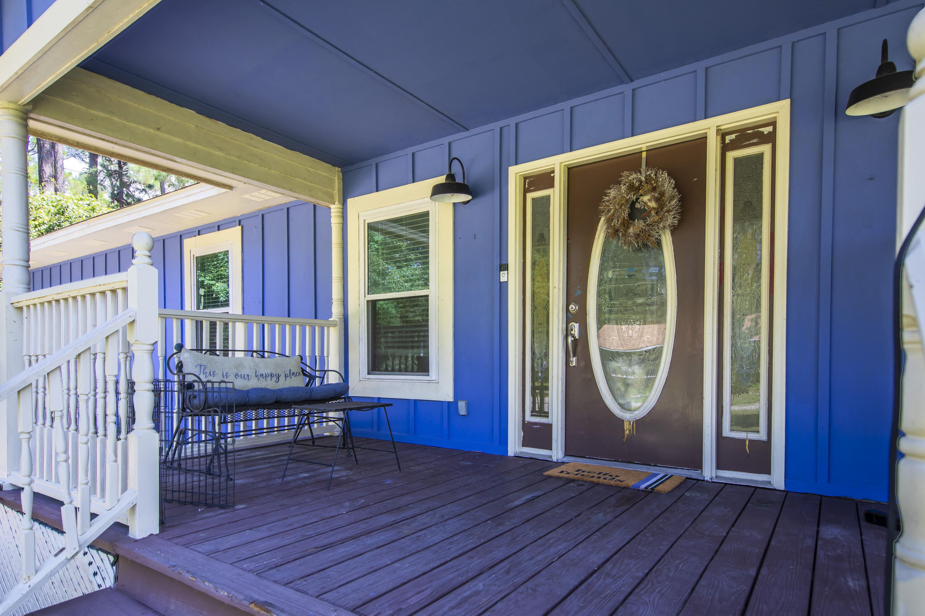 601 Chat Holley Road Santa Rosa Beach, FL 32459 - Photo 21 of 32 an empty room with wooden floor a fireplace and windows