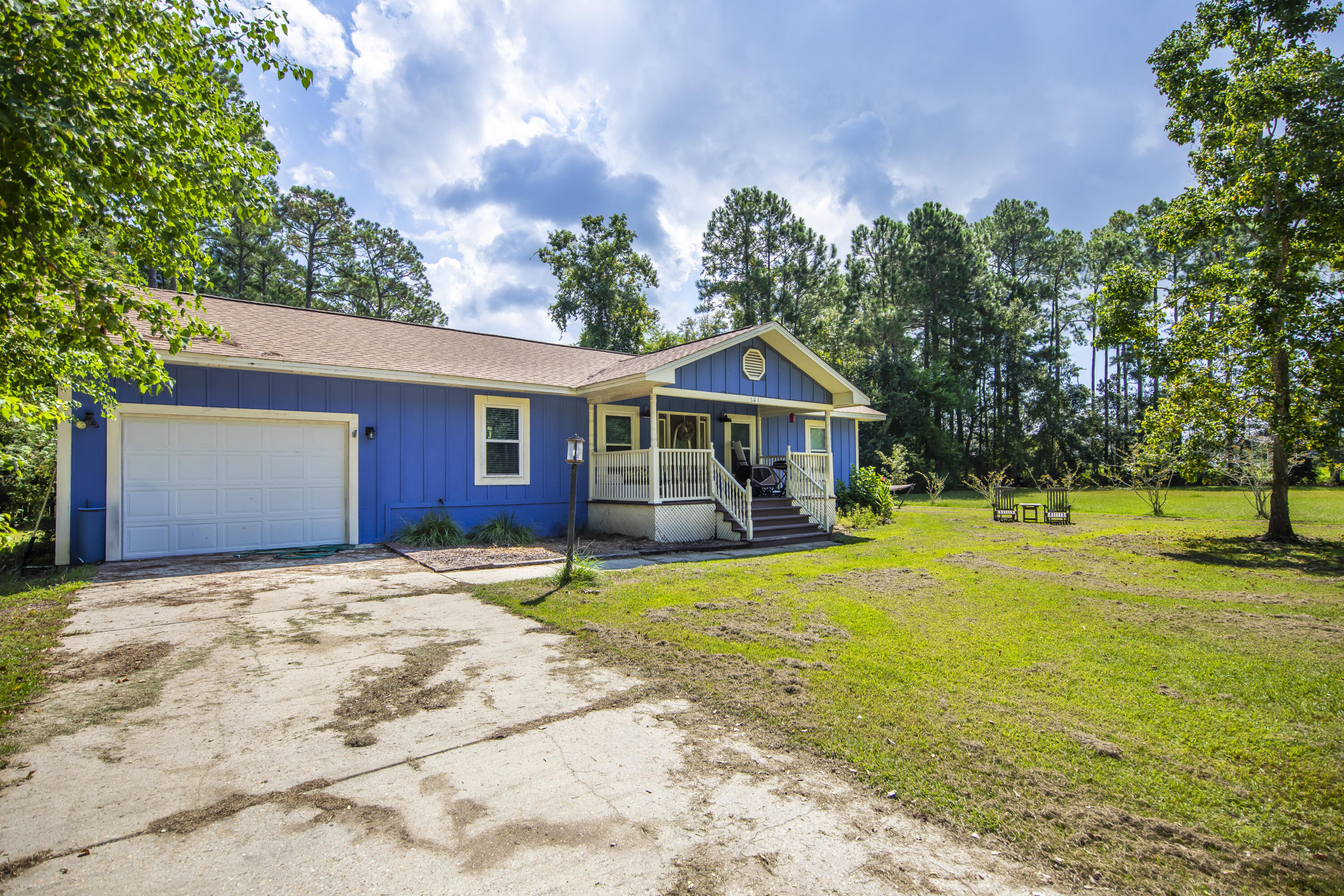 601 Chat Holley Road Santa Rosa Beach, FL 32459 - Photo 27 of 32 a front view of house with yard and trees in the background