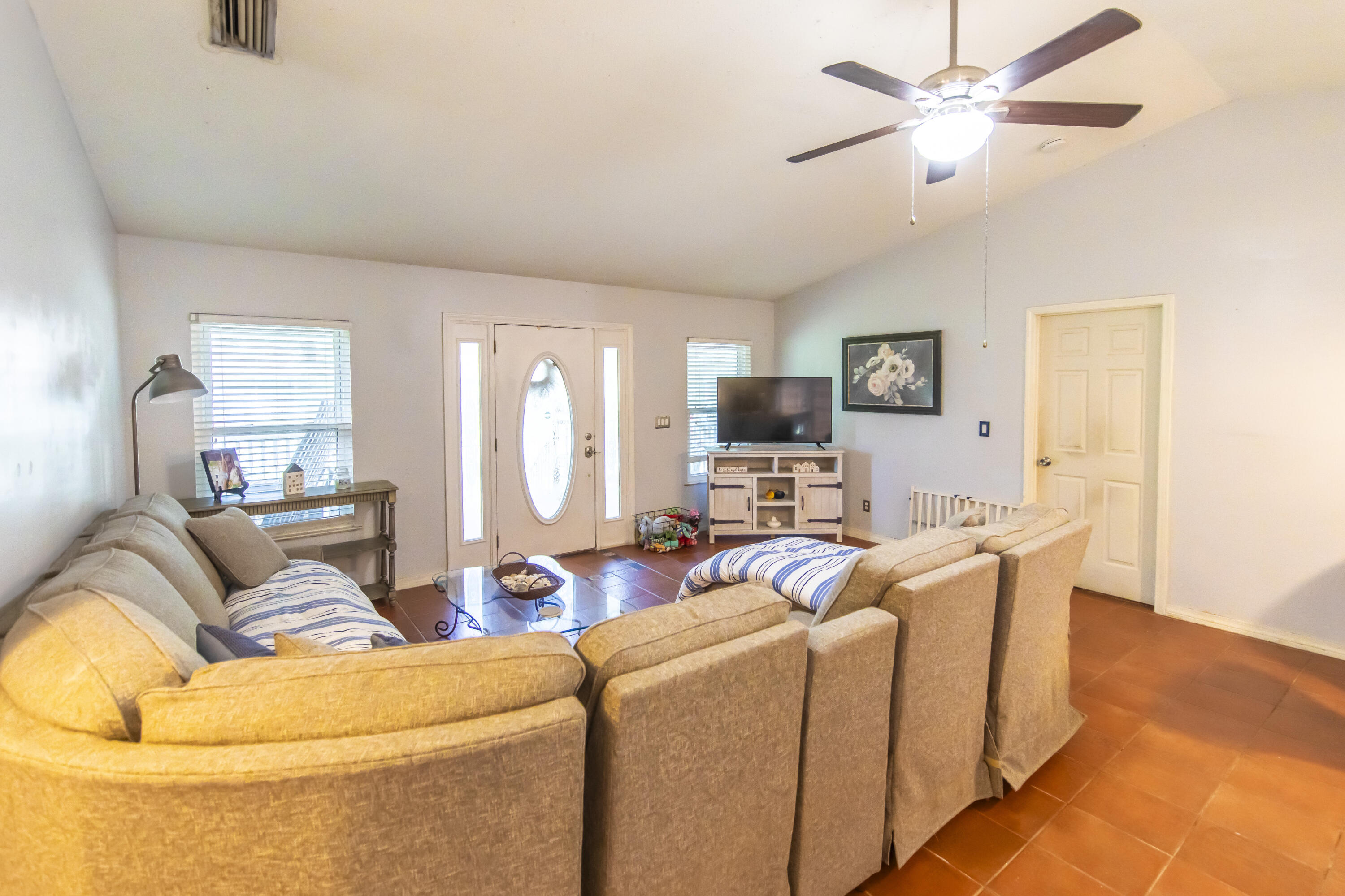 601 Chat Holley Road Santa Rosa Beach, FL 32459 - Photo 4 of 32 a living room with furniture and a flat screen tv