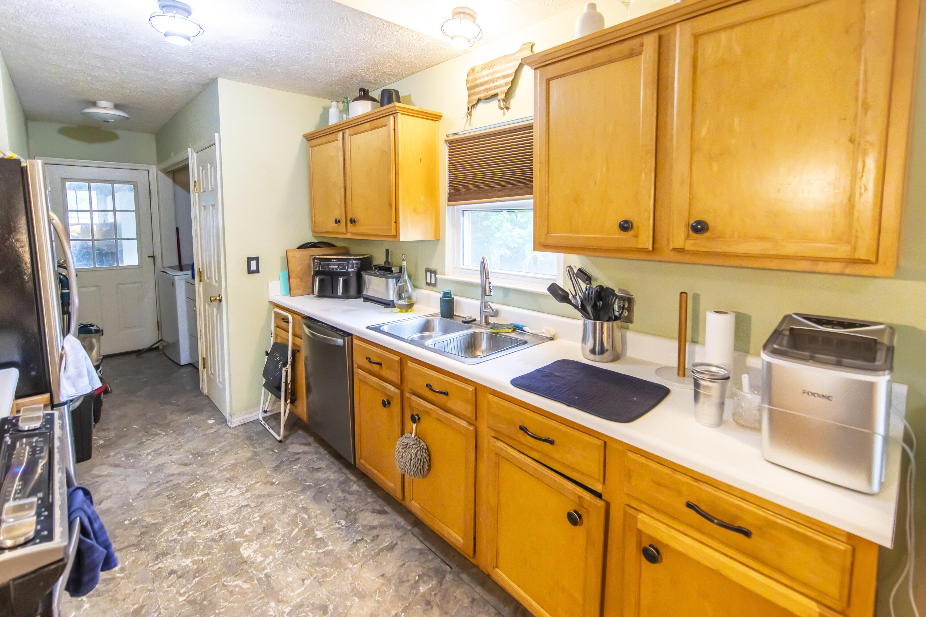 601 Chat Holley Road Santa Rosa Beach, FL 32459 - Photo 9 of 32 a kitchen with sink cabinets and window