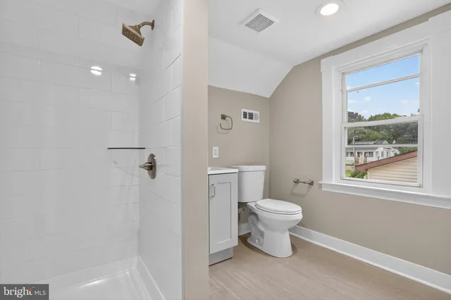 a bathroom with a toilet and a sink