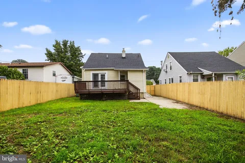 a front view of a house with yard patio and green space