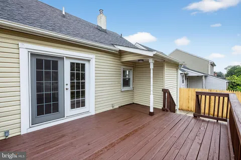 a view of a deck with wooden floor and fence