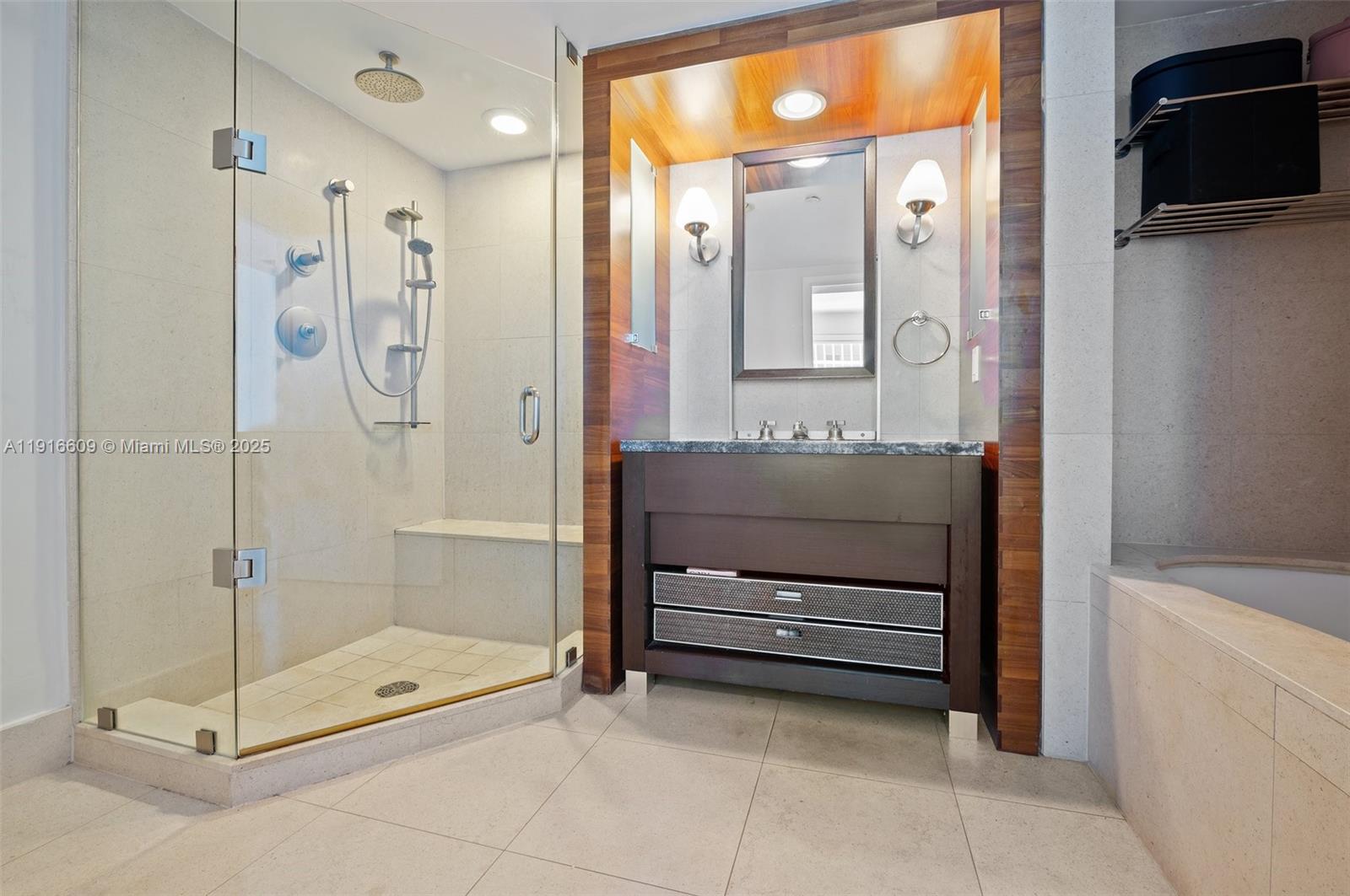 6801 Collins Avenue, Unit PH6 10) Miami Beach, FL 33141 - Photo 20 of 48 a bathroom with a shower a mirror and a sink