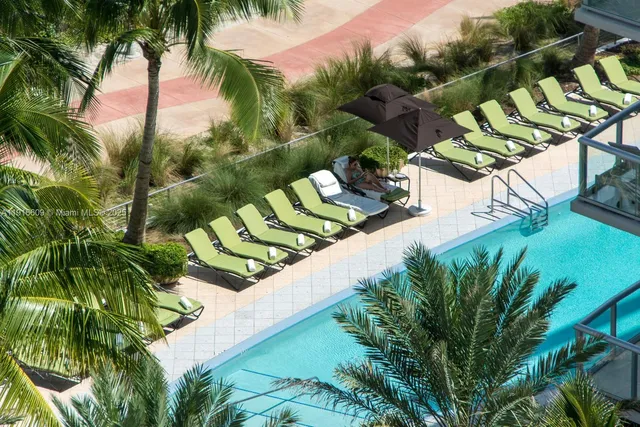 a view of swimming pool from a balcony