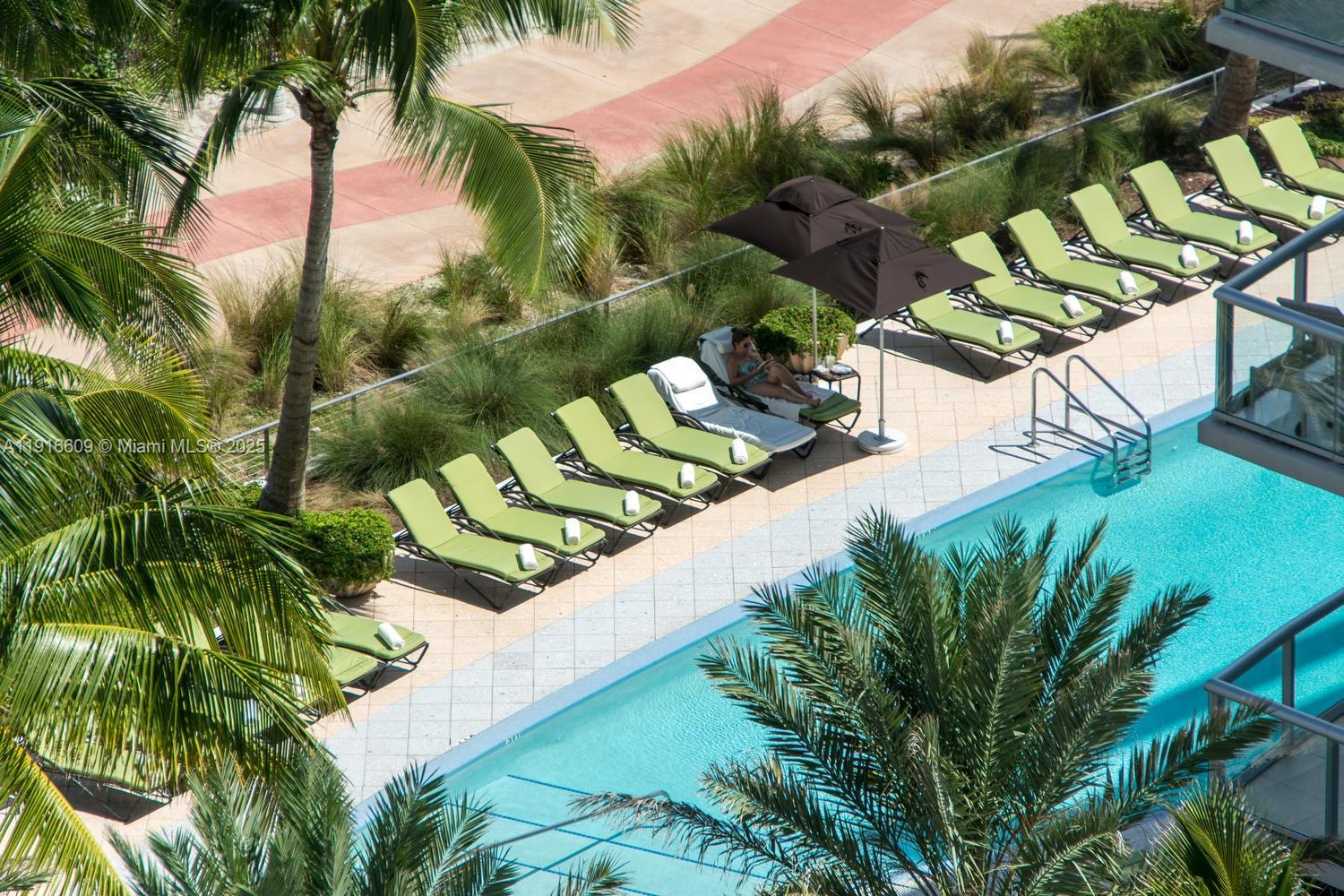 6801 Collins Avenue, Unit PH6 10) Miami Beach, FL 33141 - Photo 40 of 48 a view of swimming pool with a yard