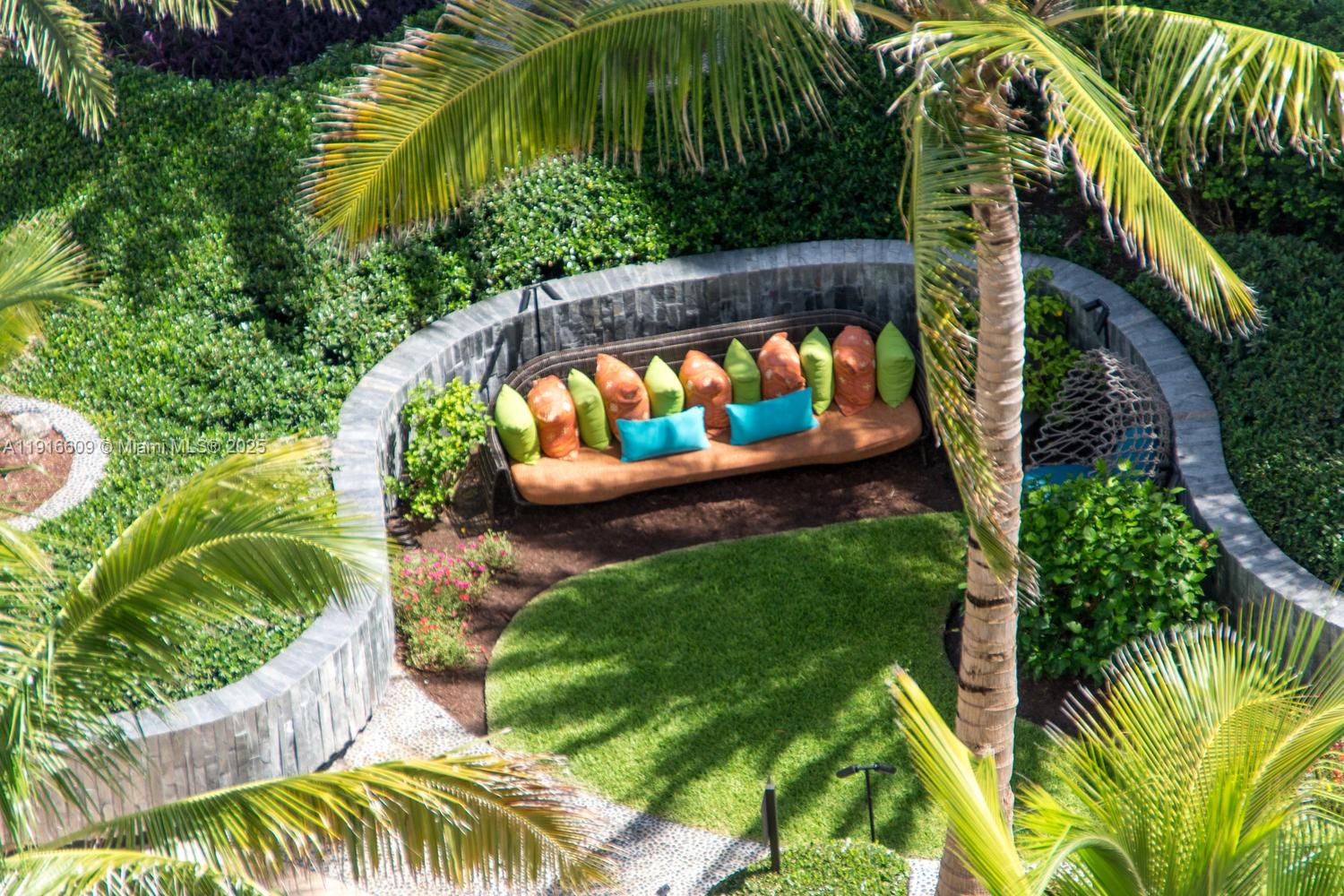 6801 Collins Avenue, Unit PH6 10) Miami Beach, FL 33141 - Photo 44 of 48 a view of a backyard with plants
