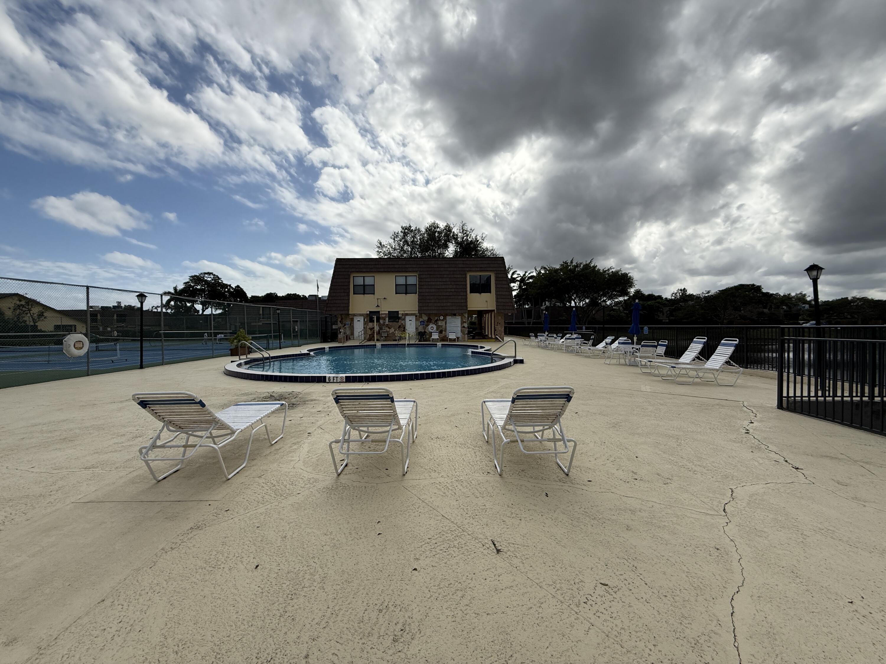 1021 Springdale Circle Palm Springs, FL 33461 - Photo 29 of 32 29 - Clubhouse Pool