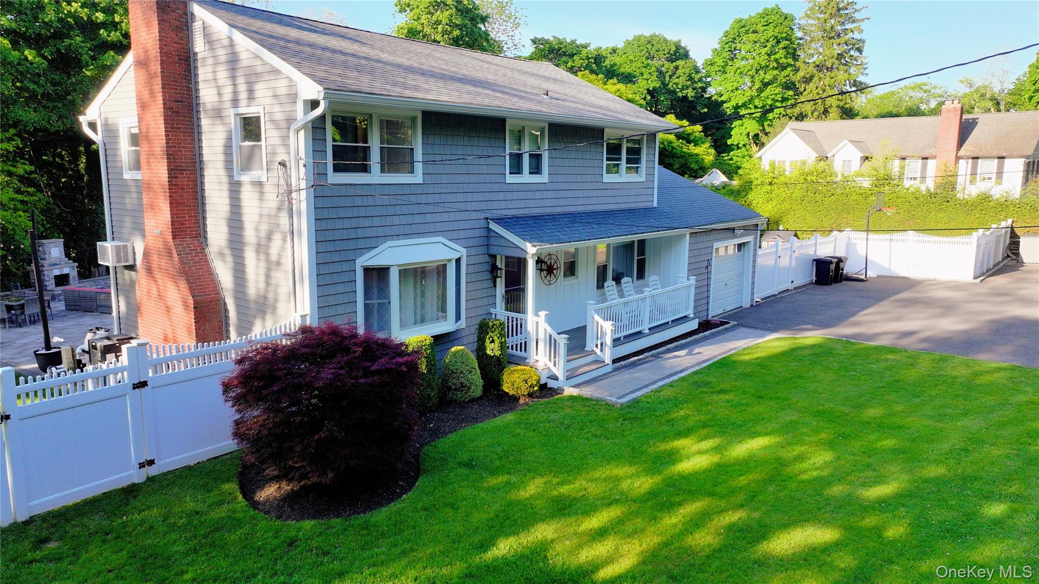 522 Moriches Road St. James, NY 11780 - Photo 48 of 49 a view of a house with a yard and sitting area