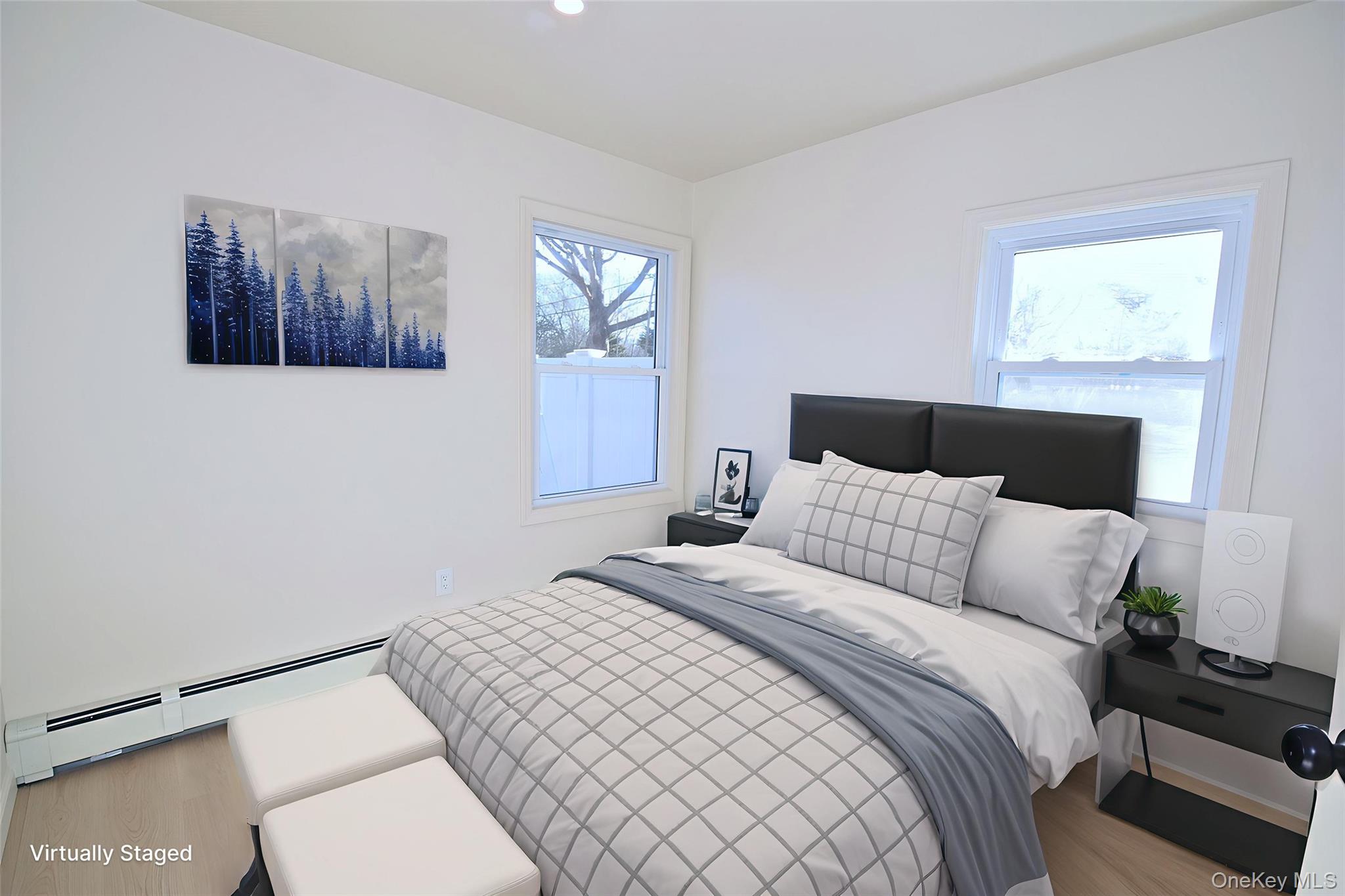 371 Oceanside Street Islip Terrace, NY 11752 - Photo 19 of 38 a bedroom with a bed and a window