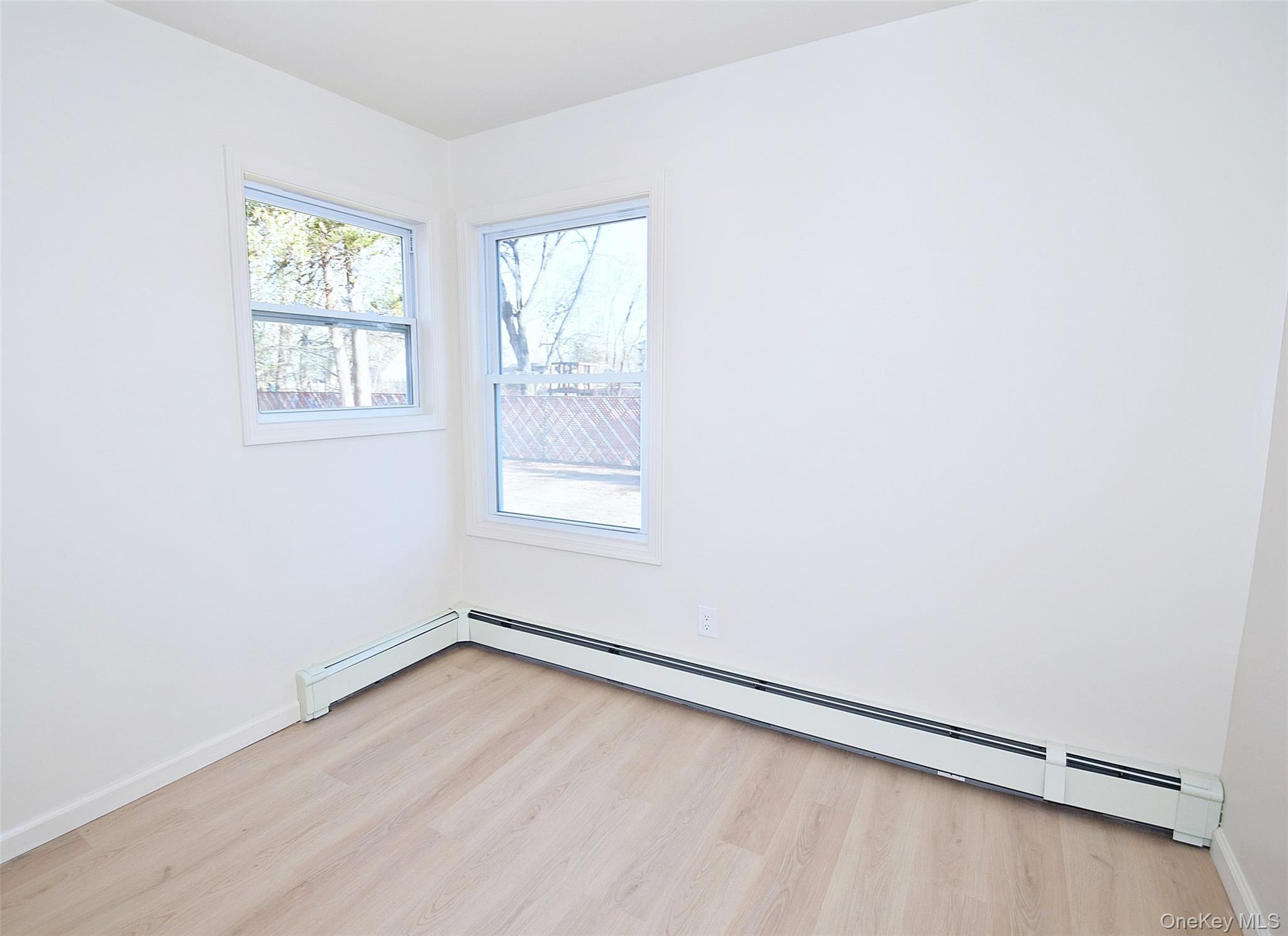 371 Oceanside Street Islip Terrace, NY 11752 - Photo 24 of 38 an empty room with a window