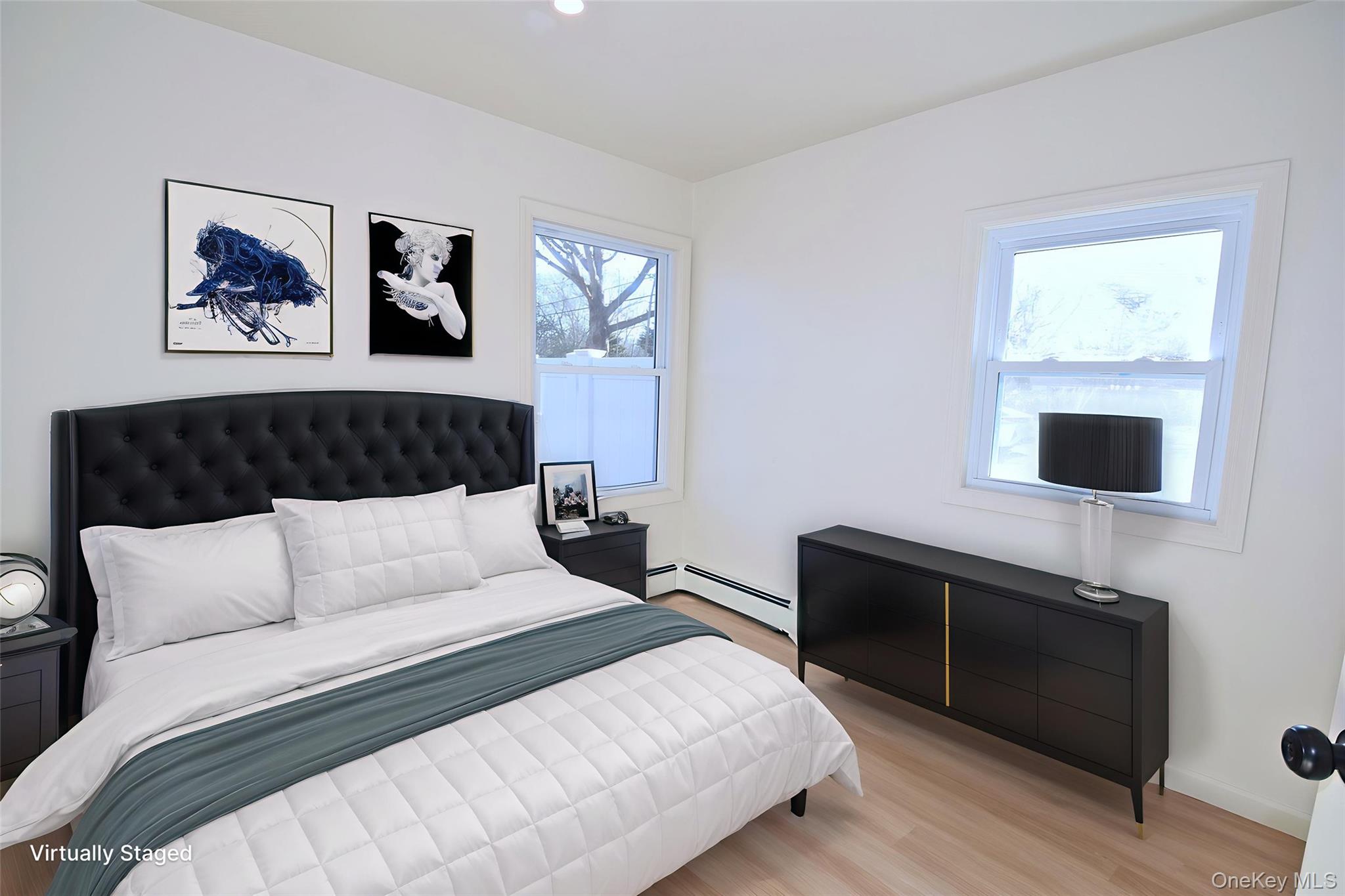 371 Oceanside Street Islip Terrace, NY 11752 - Photo 25 of 38 a bedroom with furniture and a flat screen tv