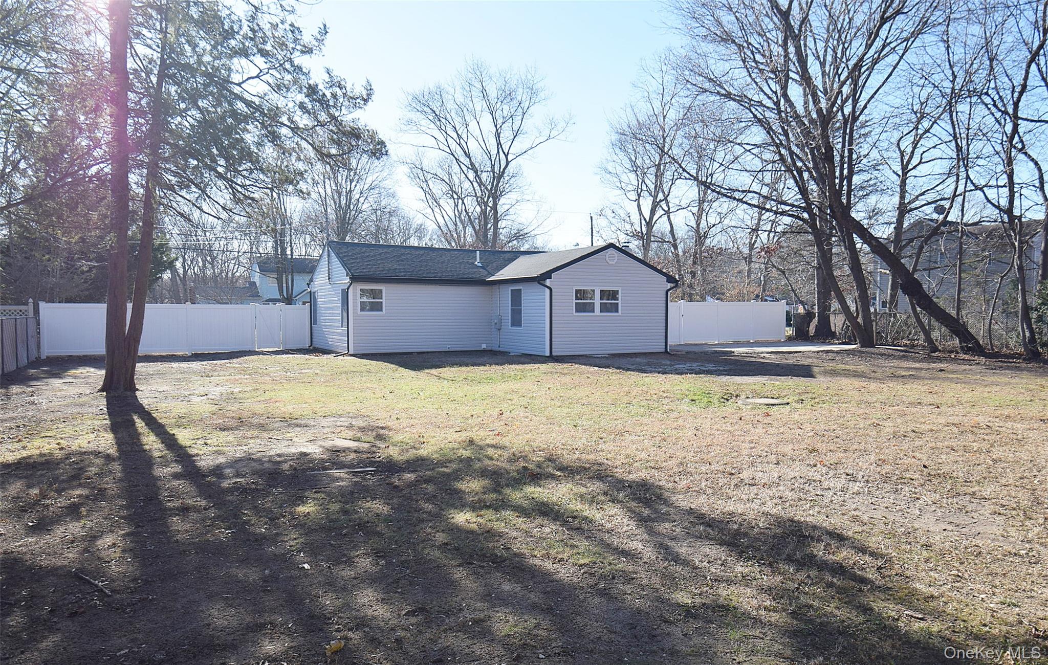 371 Oceanside Street Islip Terrace, NY 11752 - Photo 34 of 38 a house view with yard in front of it