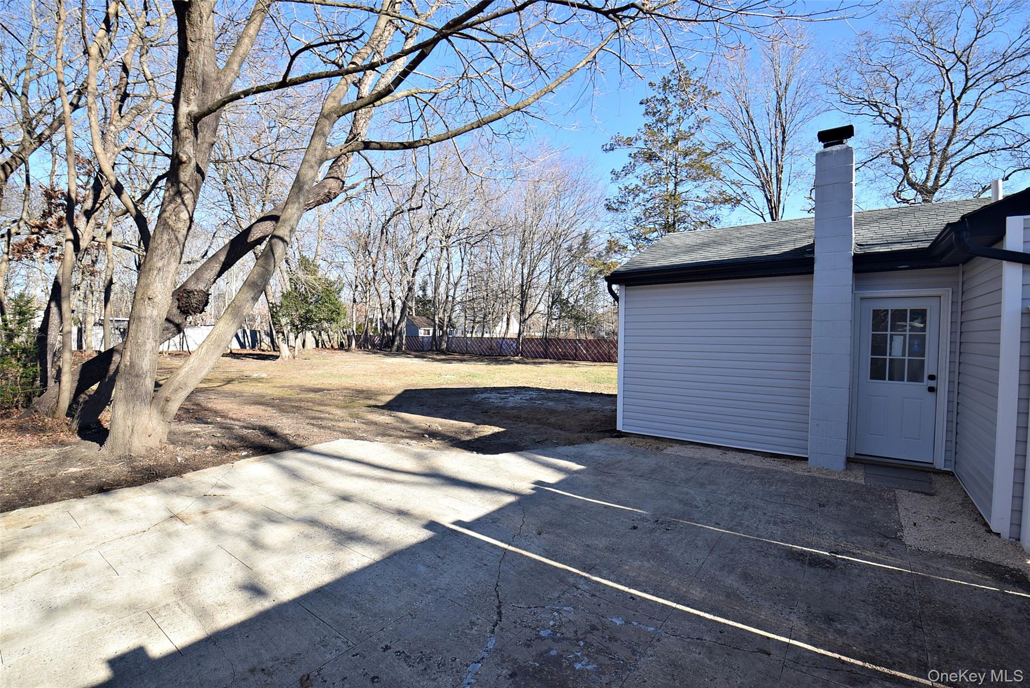 371 Oceanside Street Islip Terrace, NY 11752 - Photo 35 of 38 a view of a backyard of the house
